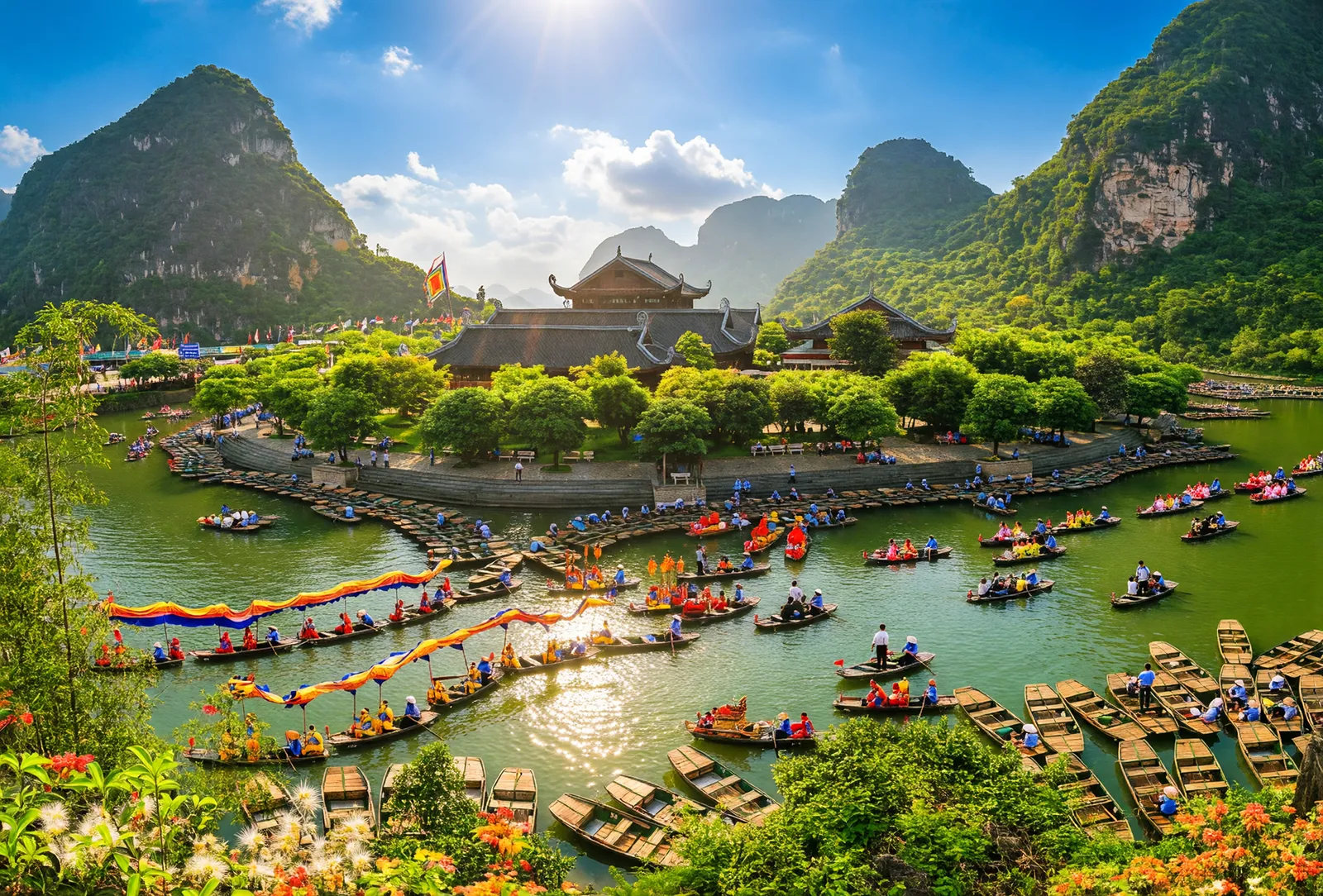 Trang An temple festival in Ninh Binh with rowing boats forming a dragon procession beneath karst mountains